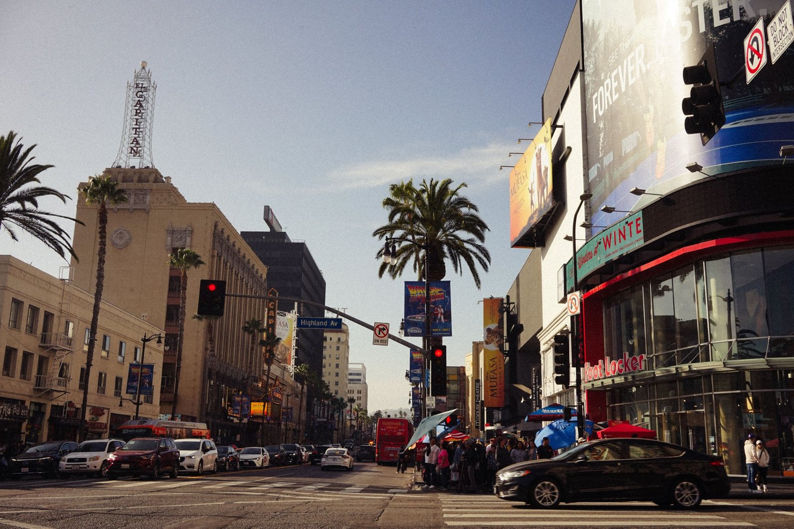 Hollywood Boulevard at Highland Avenue with the El Capitan Theatre marquee, illustrative photo